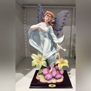 Elegant Fairy Figurine with Flowers